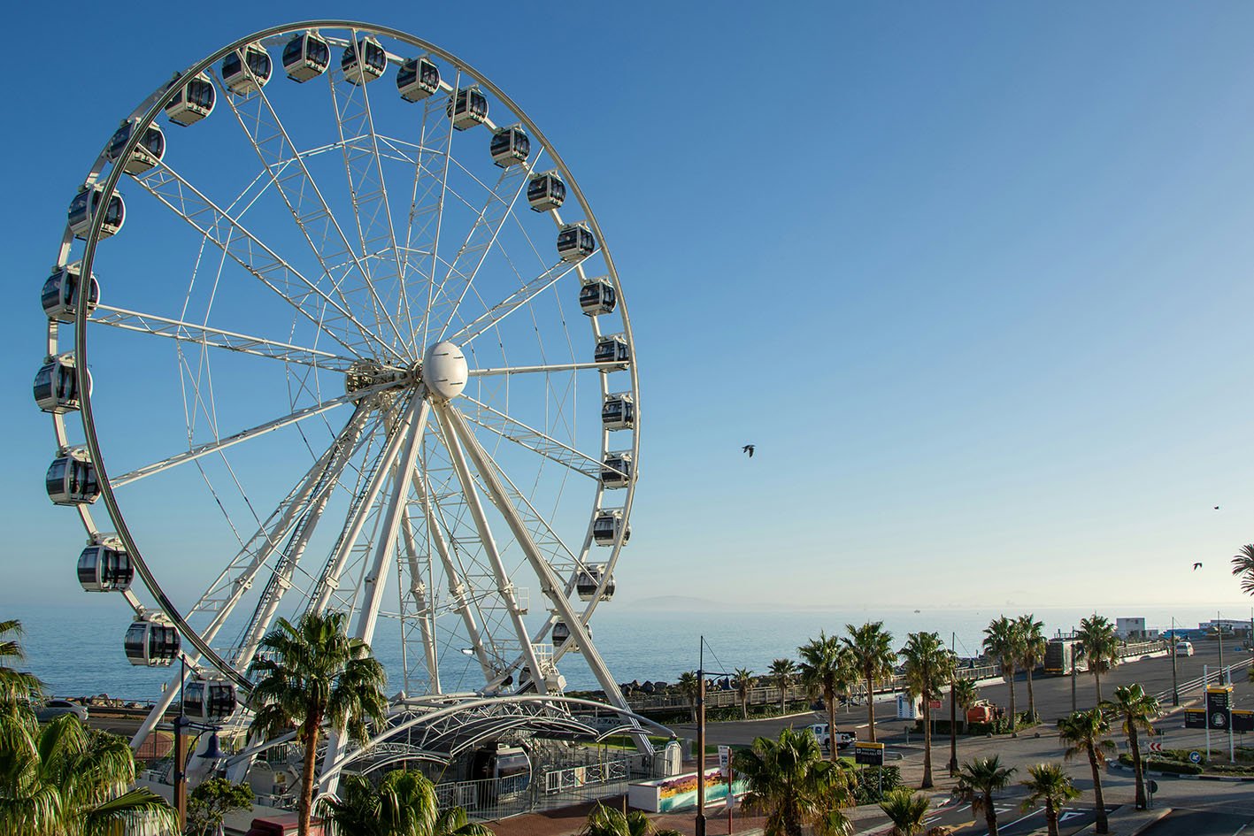 vanda-ferris-wheel-capetown Photo by <a href="https://unsplash.com/@marlinclark?utm_content=creditCopyText&utm_medium=referral&utm_source=unsplash">Marlin Clark</a> on <a href="https://unsplash.com/photos/a-large-ferris-wheel-sitting-next-to-the-ocean-dKX77GR_SB4?utm_content=creditCopyText&utm_medium=referral&utm_source=unsplash">Unsplash</a>